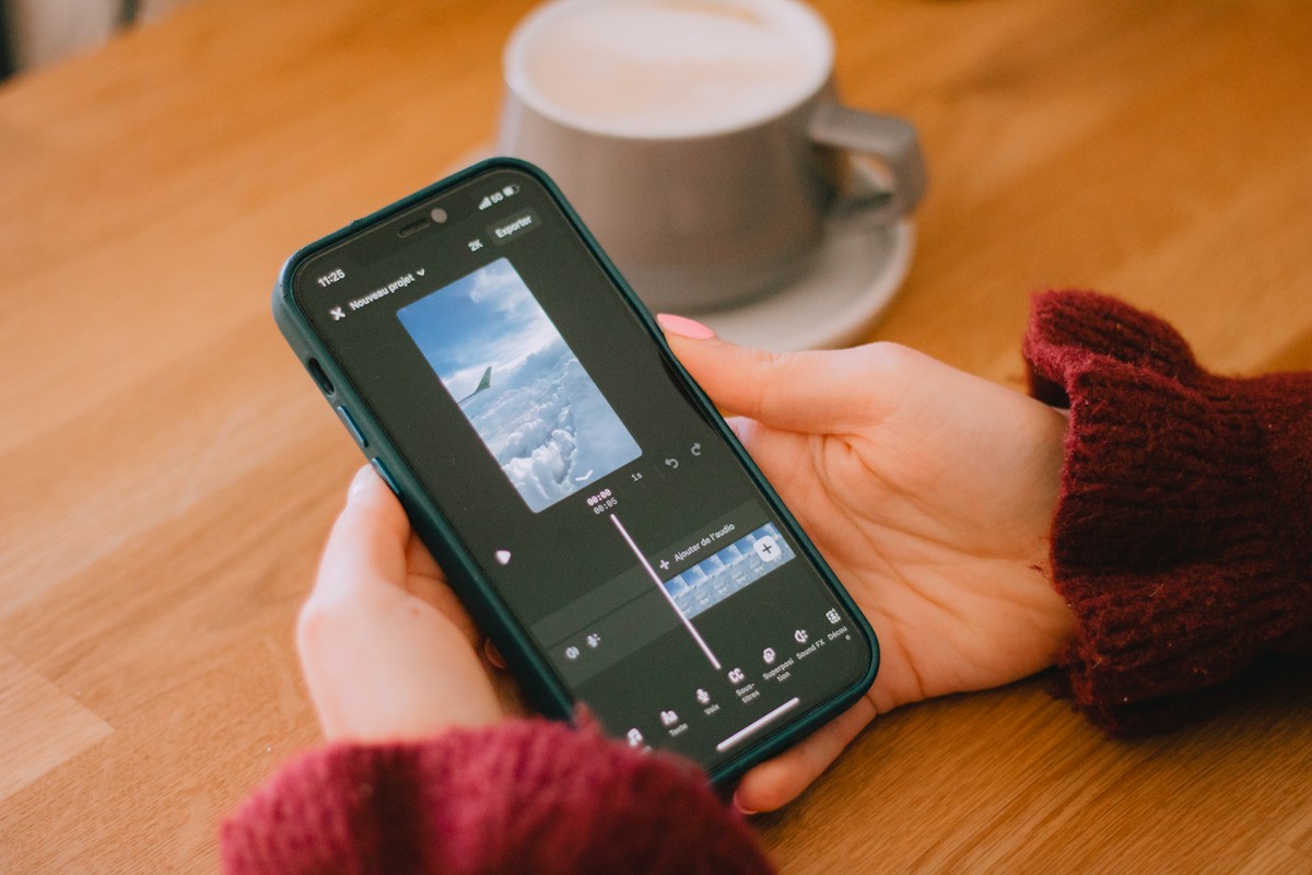 A creator editing a vertical video on a smartphone